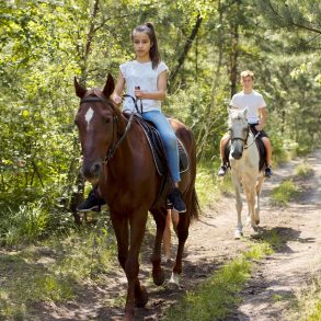 horseback riding on a trail
